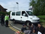 police let cars through using the grass and pavement