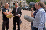 Presenting thousands of petitions to keep Community Pools open