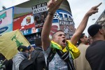 Defiant gestures by marchers at counter-demonstrators