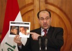 Iraq's PM Maliki displaying photos of a man he claims to be an al-Qaida leader