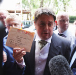 BNP leader Nick Griffin with letter addressed to his home.
