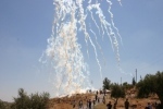 Tear gas fired from a vehicle mounted launcher in Bil'in