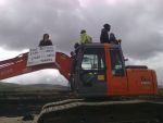 on a digger with sign