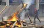 A burning barricade in Santiago yesterday