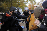 Masked officers attack protestors