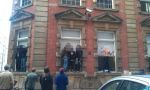 2nd April: People stood on windows frames banging windows against warmongers