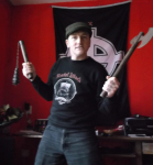 "Angers Ogg" with weapons, Nazi flag & shirt of RAC band "Brutal Attack"