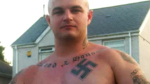 Steven White (video still) - Swastika tattoo