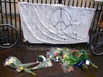 The Paris street shrine was passed by the march, outside of Great St Marys.