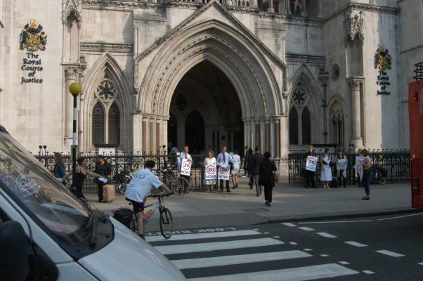 Campaigners outside the High Court handing out leaflets