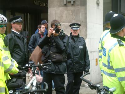 Police photographer "behaving" himself here