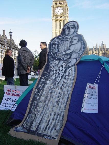 an Iraqi woman in front of tent