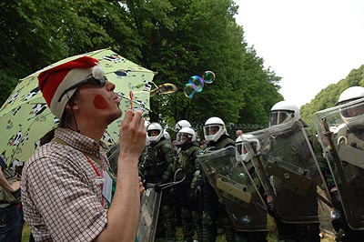 ...clown tests Police riot gear.