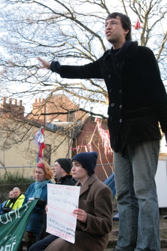 An activist explains the protest to the public