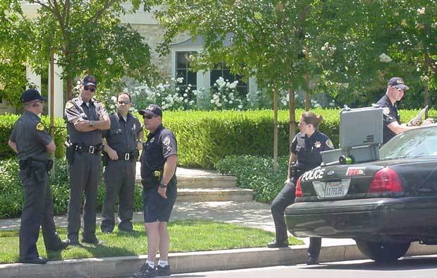 Police gathered outside Rosenbaum's home