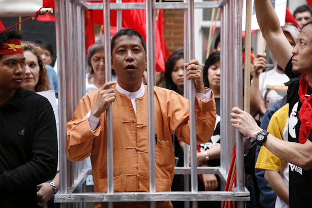 A former Burmese political prisoner demonstrates