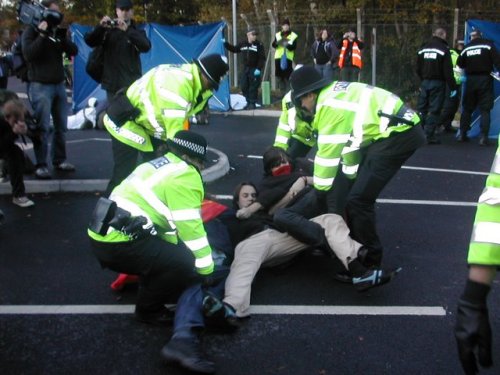 Police manhandling protesters