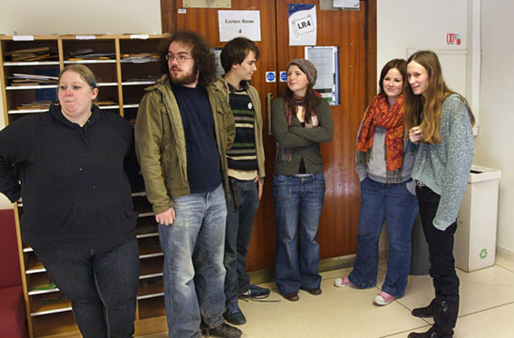 Blocking the lecture room entrance door