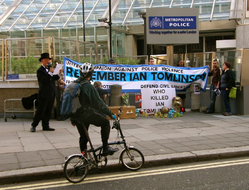 E. Cyclist lends support, as the names of dead victims of the police are intoned