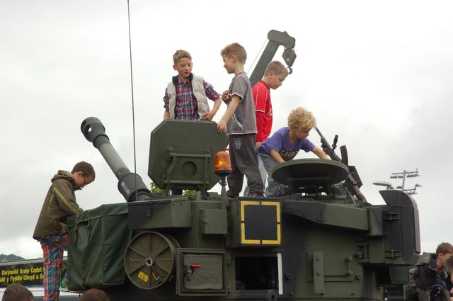 Children play on a tank