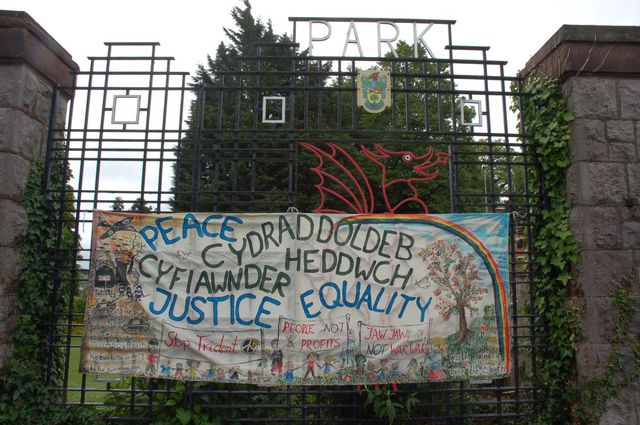 Peace, Justice, Equality banner on the park gates